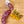 Load image into Gallery viewer, A salami called Orange Pistachio salami pictured from above on a cutting board. One half of the salami chub is cut into slices while the other half remains whole next to pistachios and orange zest.