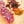 Load image into Gallery viewer, A close up of salami slices with fat, herbs and spices detailed in the salami. The slices are on a cutting board with blurred herbs and spices to the right of it.