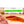 Load image into Gallery viewer, A close up of Saucisson Basque salami in packaging on a cutting board with blurred salami slices, herbs and spices in the foreground. 

